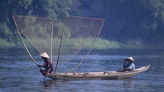 Fisherman Perfume River Hue Vietnam